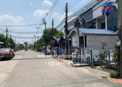 Exterior street view of residential area with townhouses