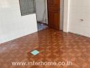Unfurnished bedroom in need of renovation with tiled flooring
