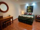 Elegant bedroom with Buddha wall art and hardwood flooring
