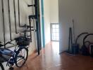 Utility room with bicycles and exposed piping
