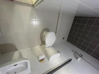 Modern bathroom interior with white and black tiles