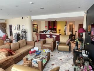 Spacious and elegantly decorated living room with connected dining area