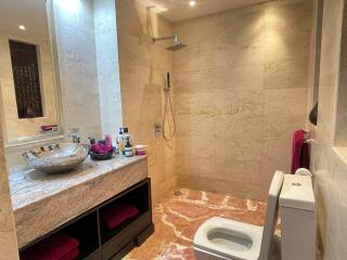 Elegant bathroom with marble finishes and modern fixtures