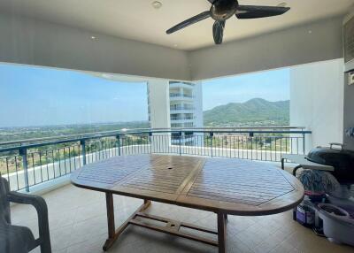 Spacious balcony with scenic mountain view and outdoor furniture