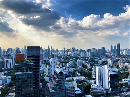Panoramic view of a bustling cityscape under cloudy skies