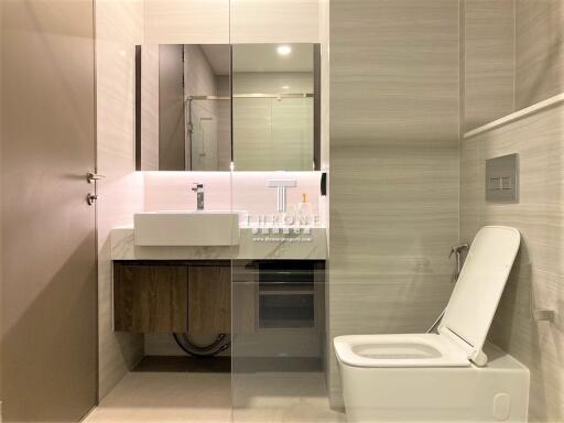 Modern and sleek bathroom interior with illuminated mirror