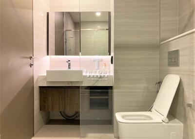 Modern and sleek bathroom interior with illuminated mirror