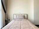 minimalist designed bedroom with neat bedding and elegant decor