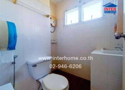 Bright and clean bathroom with white tile decor