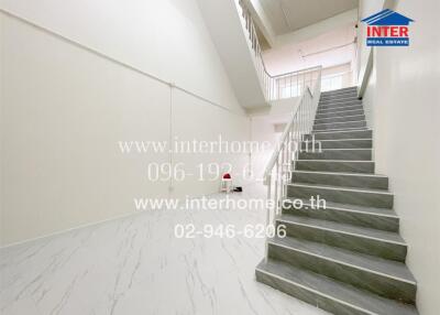 Bright and modern staircase interior with white walls