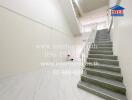 Bright and modern staircase interior with white walls