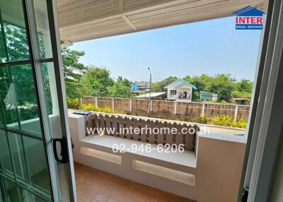 Spacious balcony overlooking a quiet neighborhood