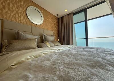 Luxurious bedroom with ocean view and stylish decor