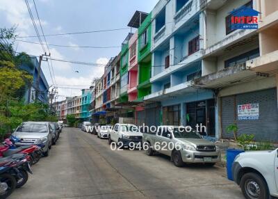 Colorful townhouses along a quiet street
