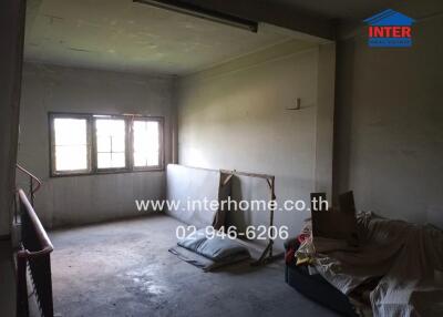 Spacious unfurnished room with large windows and natural light