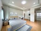 Spacious master bedroom with modern decor and plenty of natural light