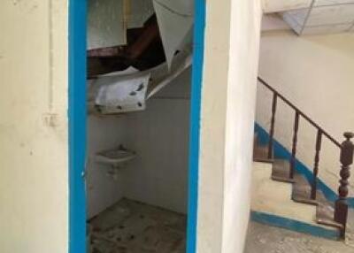 View of a cluttered staircase within a residential building