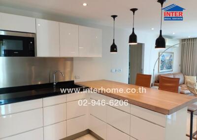 Modern kitchen with integrated appliances and open plan layout