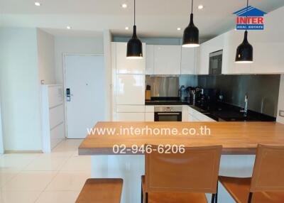 Modern kitchen with dining area in bright interior