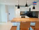 Modern kitchen with dining area in bright interior