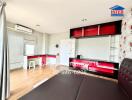 Bright and modern kitchen with red accents and ample shelving