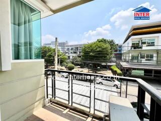 Spacious balcony overlooking the street with ample sunlight