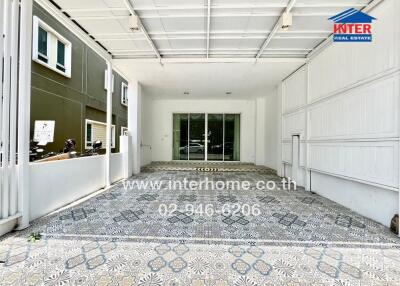 Spacious and well-lit garage with decorative floor tiles