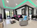 Spacious modern living room with stylish decor and abundant natural light