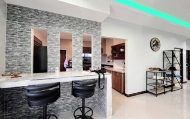 Modern open kitchen with breakfast bar and elegant interior design
