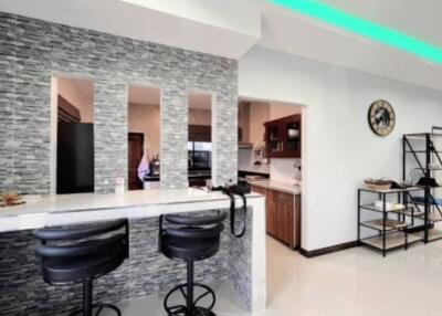 Modern open kitchen with breakfast bar and elegant interior design