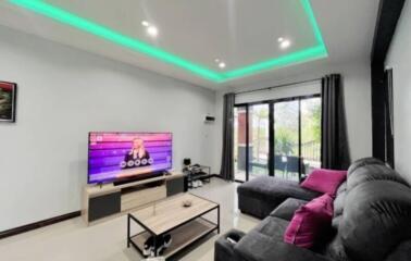 Modern living room with stylish decor and ambient lighting