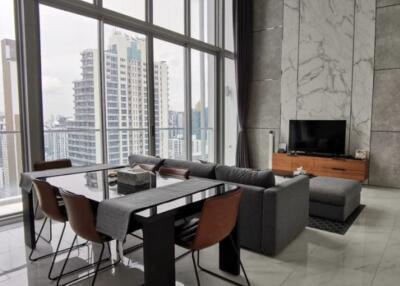 Spacious living room with dining area and city view