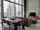 Modern living room with city view through large windows