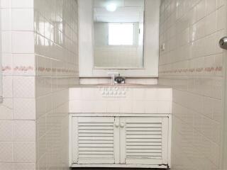Bright tiled bathroom with minimalist design
