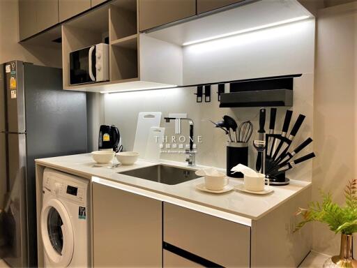 Modern kitchen with integrated appliances and neat storage