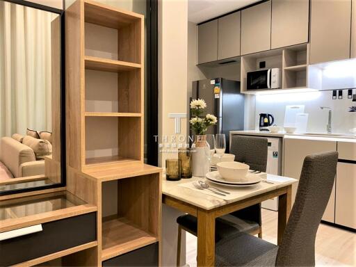 Modern kitchen and dining area with integrated living space