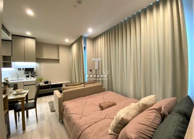Modern bedroom with integrated living and kitchen area