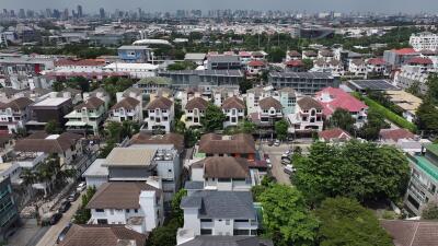 Aerial view of a dense residential neighborhood with varied housing designs