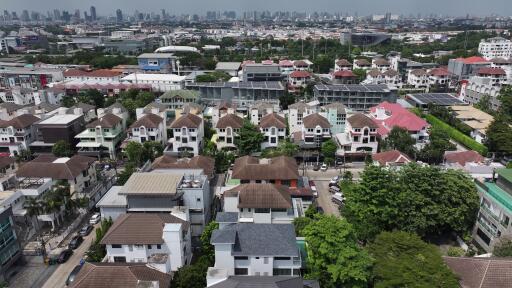 Aerial view of a dense residential neighborhood with varied housing designs