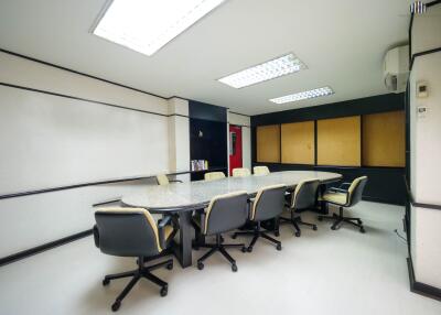 Spacious conference room with modern chairs and professional decor