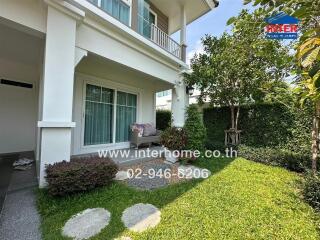 Suburban house with landscaped garden and spacious porch