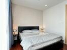 Modern bedroom with minimalist design and elegant furnishings