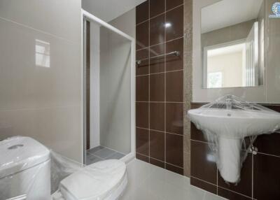 Modern bathroom with shower and ceramic fixtures