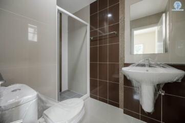Modern bathroom with shower and ceramic fixtures
