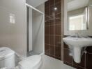 Modern bathroom with shower and ceramic fixtures