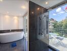 Modern bathroom with freestanding tub and outdoor access