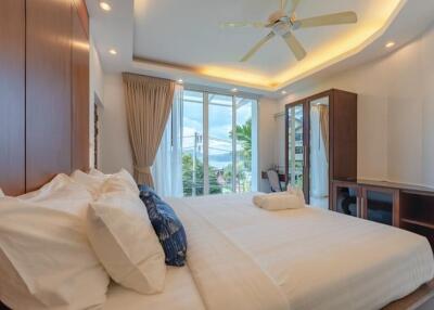 Bright and luxurious bedroom with modern amenities and scenic view