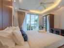 Bright and luxurious bedroom with modern amenities and scenic view