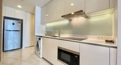 Modern kitchen with stainless steel appliances and white cabinetry