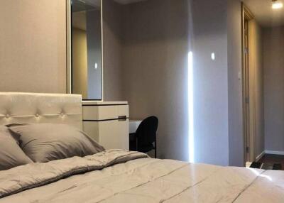 Elegant bedroom with modern decor and soft lighting